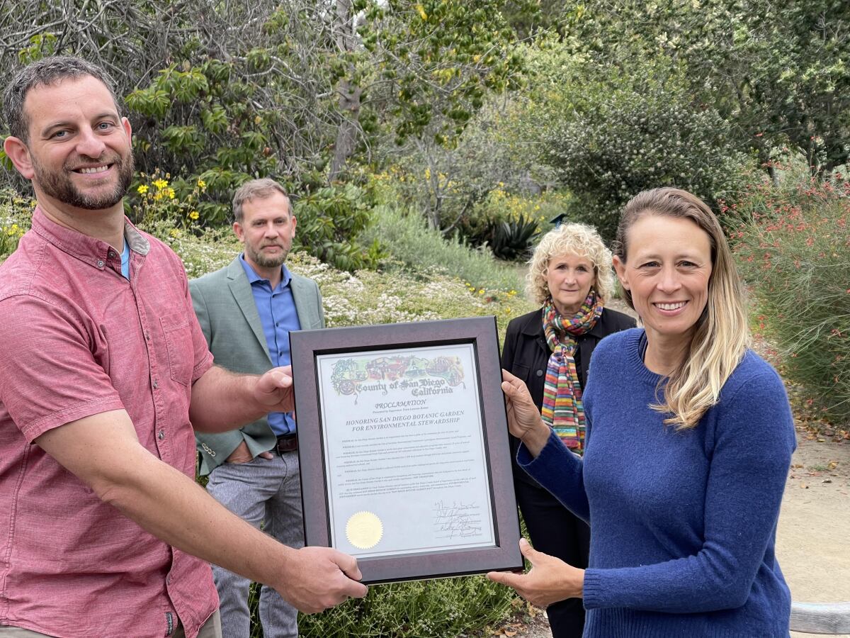 Plaque held up pronouncing San Diego Botanical Garden Day 