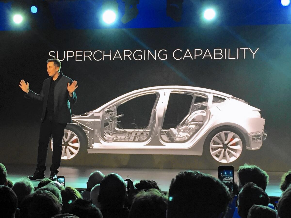 Tesla Chief Executive Elon Musk speaks at the unveiling Thursday night in Hawthorne