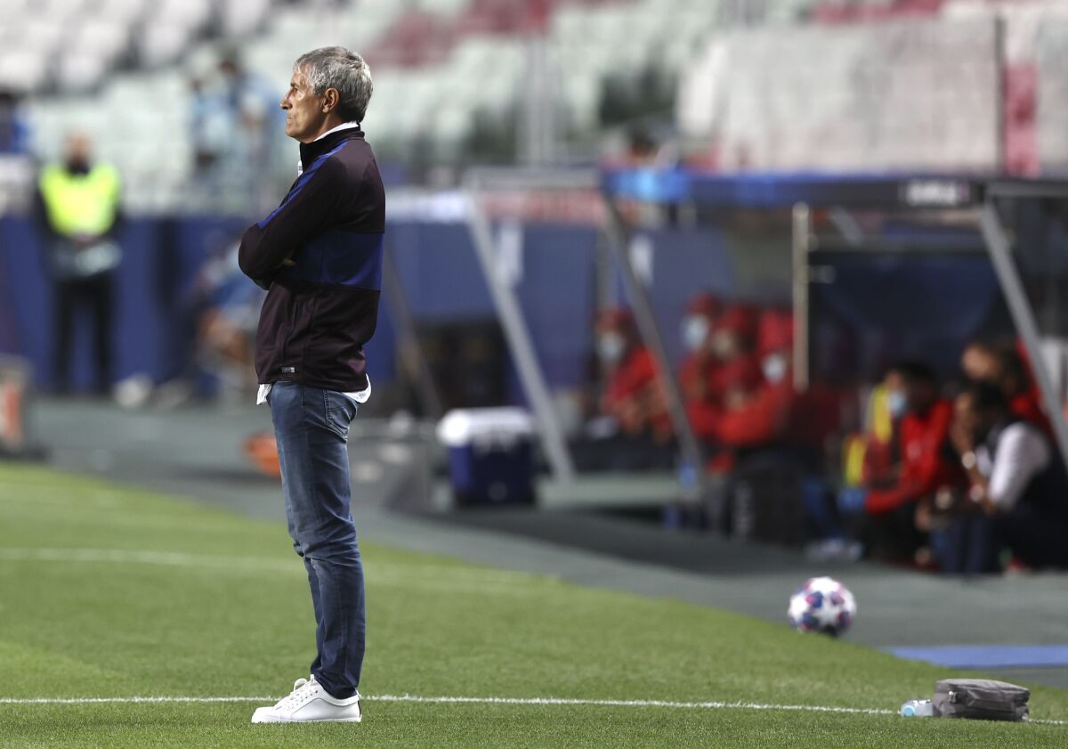 Barcelona's head coach Quique Setien watches from the sideline during the Champions League quarterfinal soccer match between Barcelona and Bayern Munich in Lisbon, Portugal, Friday, Aug. 14, 2020. (Rafael Marchante/Pool via AP)