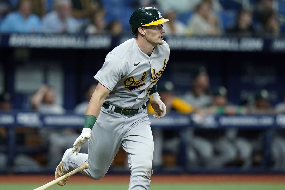 Oakland Athletics' Sean Murphy watches his three-run home run off Tampa Bay Rays starting pitcher Shane McClanahan during the third inning of a baseball game Wednesday, April 13, 2022, in St. Petersburg, Fla. (AP Photo/Chris O'Meara)