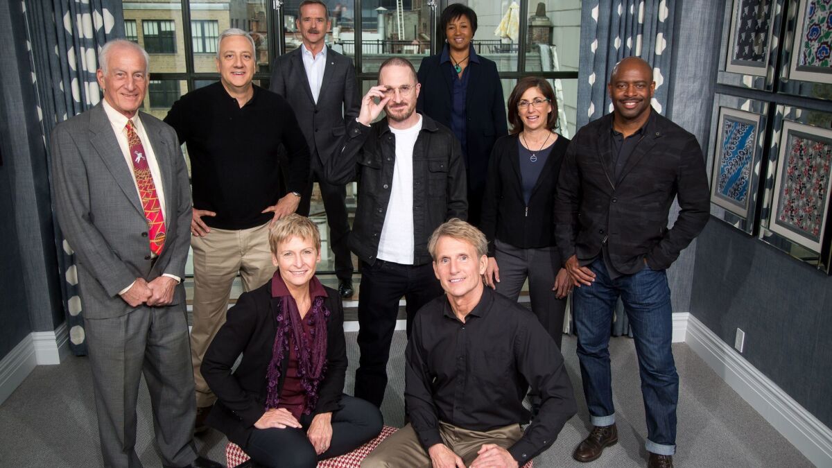 Darren Aronofsky, director of National Geographic's "One Strange Rock," center, is photographed with astronaut hosts from the series at the Whitby Hotel in New York City.