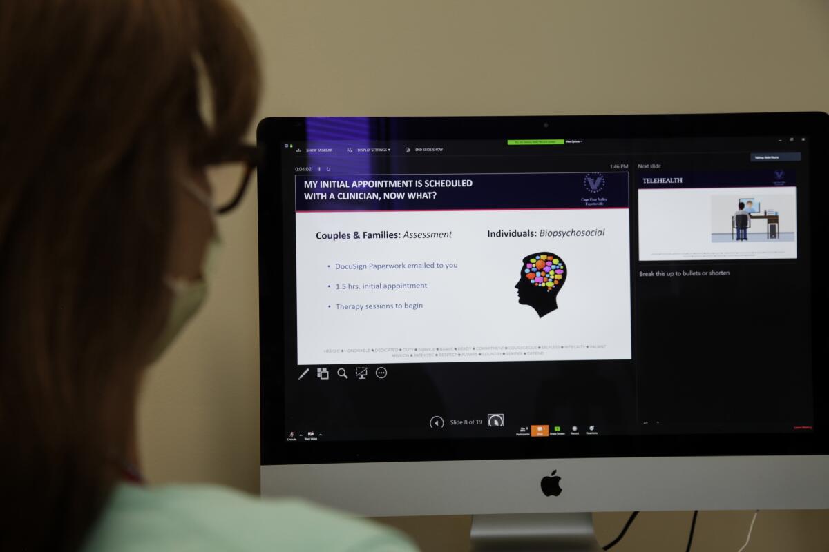 A patient stares at screen slide of mental health care