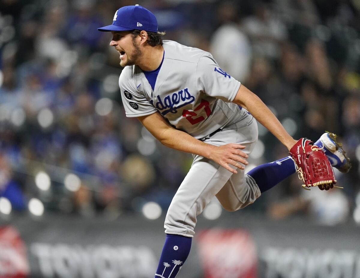Los Angeles Dodgers starting pitcher Trevor Bauer works against the Colorado Rockies in the fifth inning of a baseball game Friday, April 2, 2021, in Denver. (AP Photo/David Zalubowski)