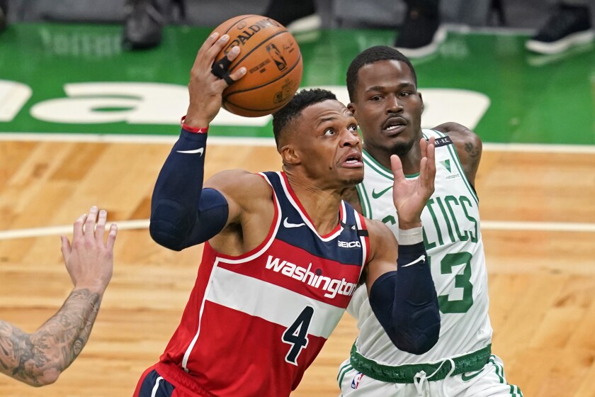 Washington Wizards guard Russell Westbrook (4) drives against Boston Celtics guard Javonte Green during the first quarter of an NBA basketball game Friday, Jan. 8, 2021, in Boston. (AP Photo/Elise Amendola)
