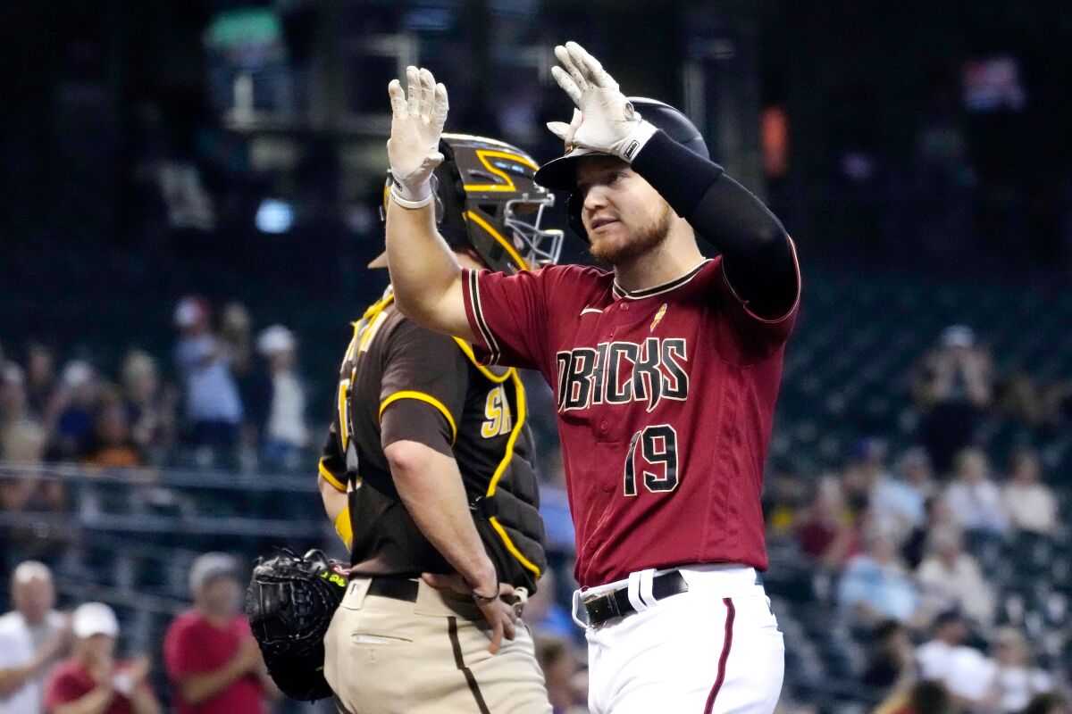 Arizona Diamondbacks' Josh VanMeter (19) reacts after hitting a two-run home run against the San Diego Padres in the third inning during a baseball game, Wednesday, Sept. 1, 2021, in Phoenix. (AP Photo/Rick Scuteri)