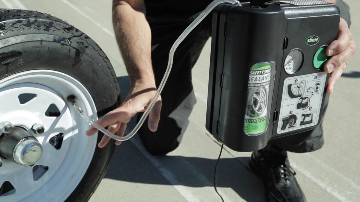 Many current new cars are sold equipped with a flat repair kit, such as this combination sealant and air compressor, instead of full-size spare tires or temporary "donut" spares.