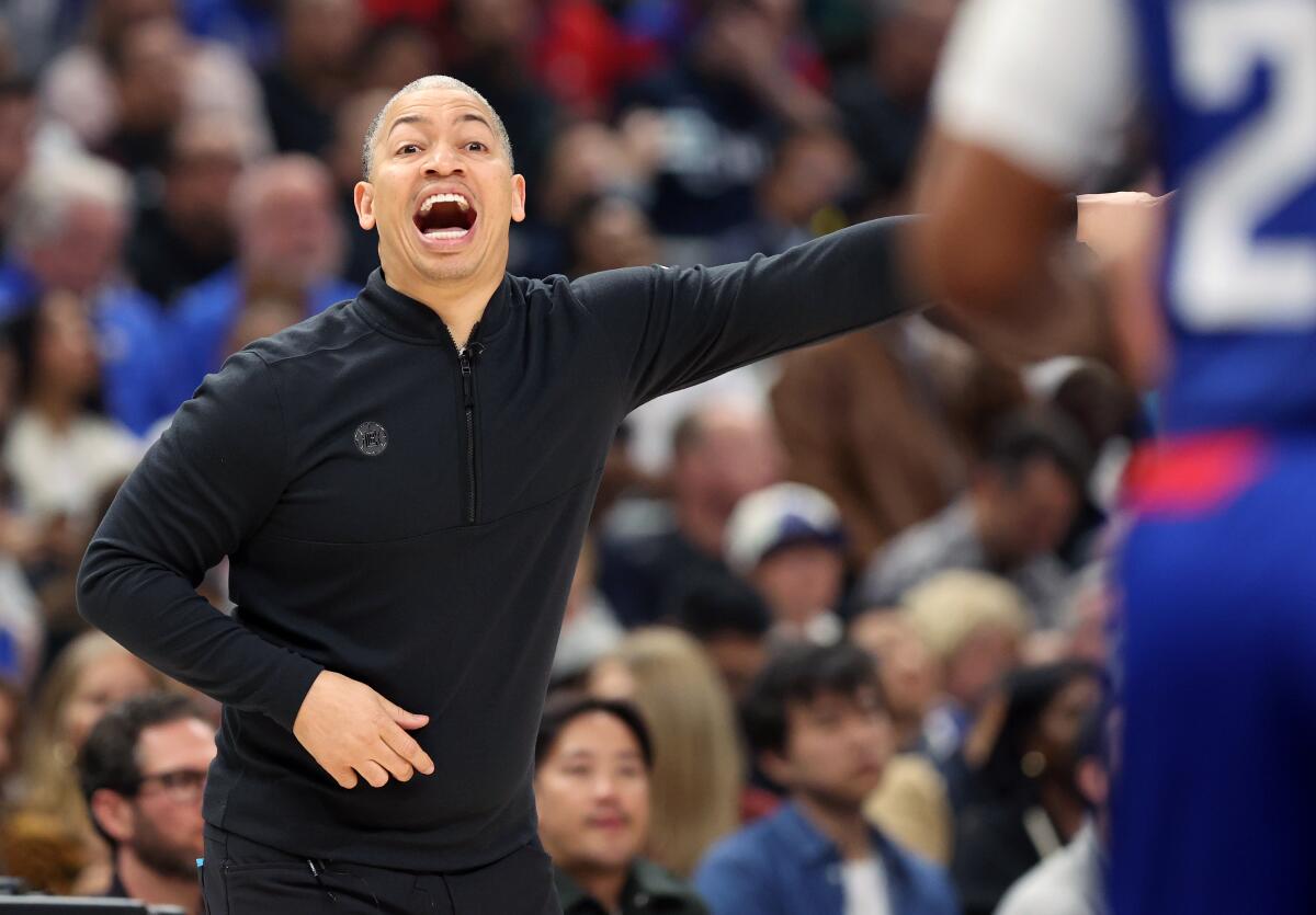 Clippers coach Tyronn Lue yells directions to players during a game against the Timberwolves last season.