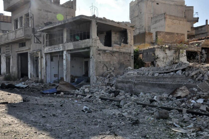 Buildings in the old city of Homs, Syria, lie in ruins on Monday.