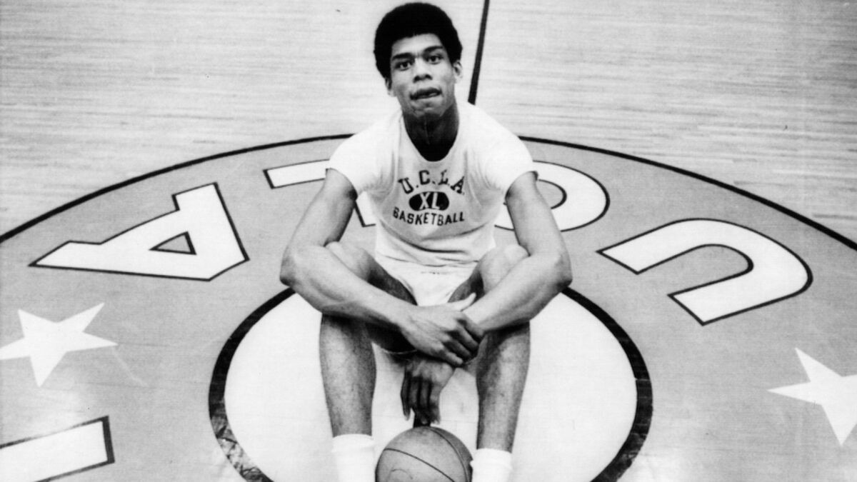 UCLA's Lew Alcindor sits at center court at Pauley Pavilion in 1969.