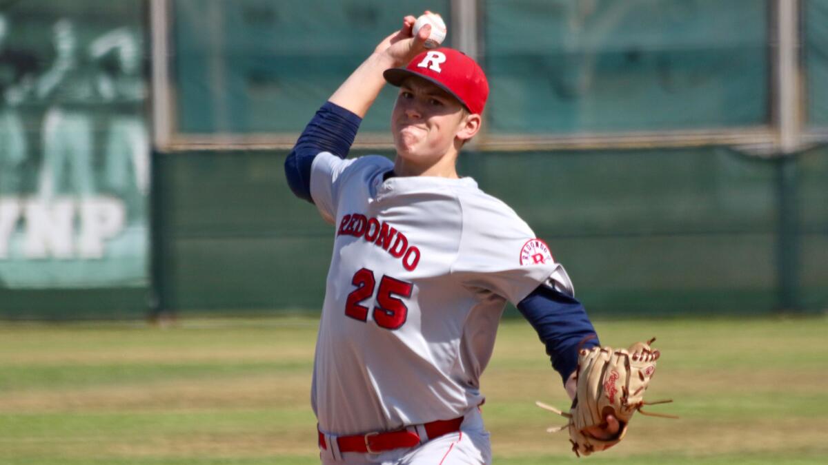 Redondo senior Sean Reynolds delivers a pitch against Mira Costa on May 10.