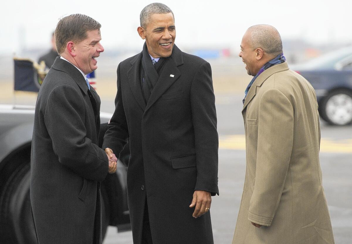President Obama talks with Boston Mayor Martin Walsh, left, and Massachusetts Gov. Deval Patrick, both Democrats. Obama's latest change to the Affordable Care Act was requested by Democrats facing tough reelection campaigns this year.