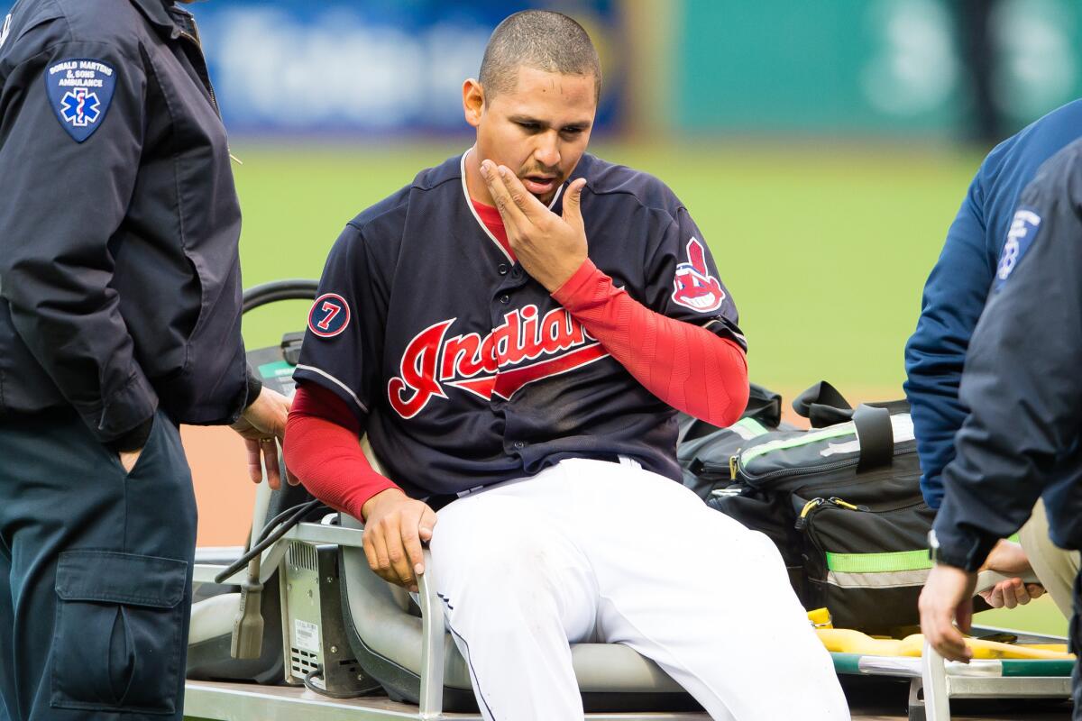 Indians starting pitcher Carlos Carrasco is carted off the field after being hit in the face by a Melky Cabrera line drive.