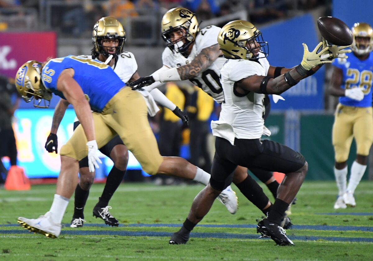 Colorado safety Mark Perry intercepts a pass intended for UCLA tight end Greg Dulcich in the first quarter.