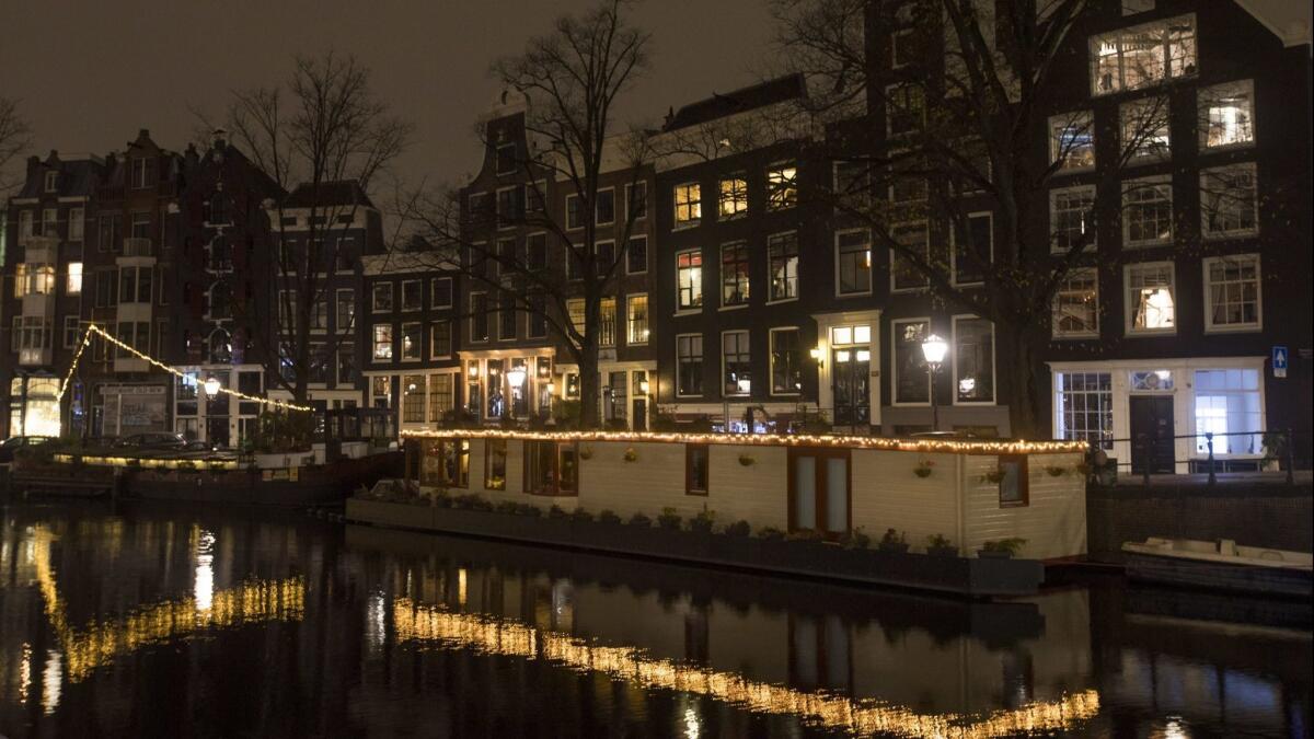 The Prinsengracht canal in Amsterdam at night.