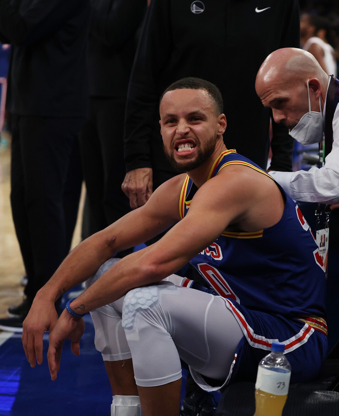 Stephen Curry makes faces from the bench after making a three-point basket to break Ray Allen’s record.