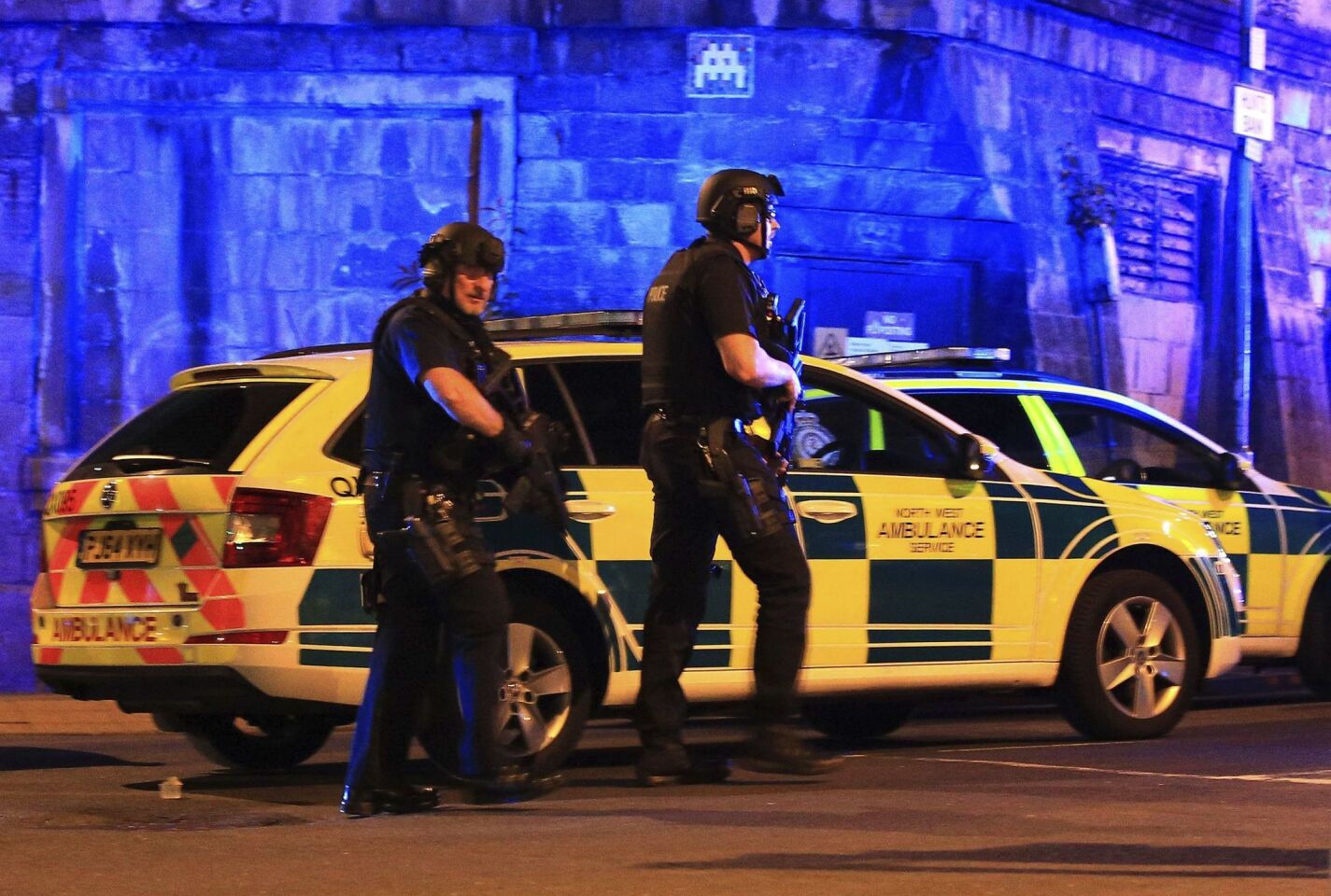 Armed police at Manchester Arena after reports of an explosion at the venue during an Ariana Grande concert Monday night.