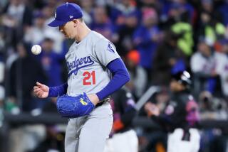 NEW YORK, NEW YORK - OCTOBER 16: Walker Buehler #21 of the Los Angeles Dodgers tosses a ball.