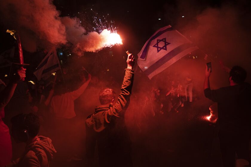 Israelis protest against plans by Prime Minister Benjamin Netanyahu's government to overhaul the judicial system, in Tel Aviv, Israel, Thursday, March 9, 2023. (AP Photo/Oded Balilty)