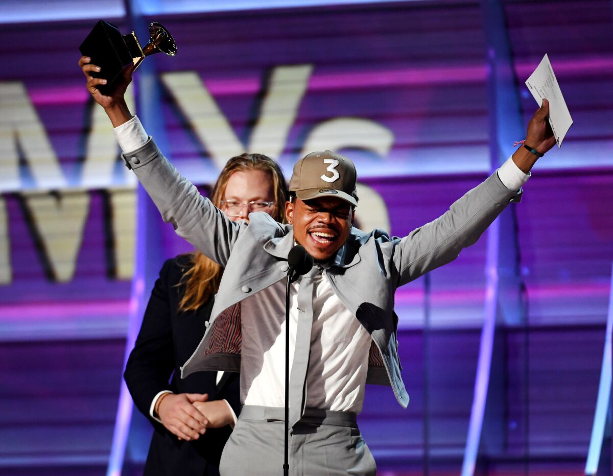 Chance the Rapper accepts the award for rap album onstage during the 59th Grammy Awards