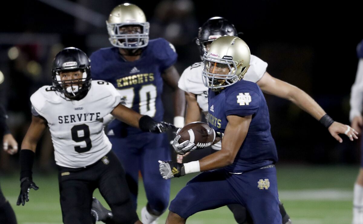 Sherman Oaks Notre Dame wide receiver Sean Guyton makes a catch during a 16-13 loss to Anaheim Servite.