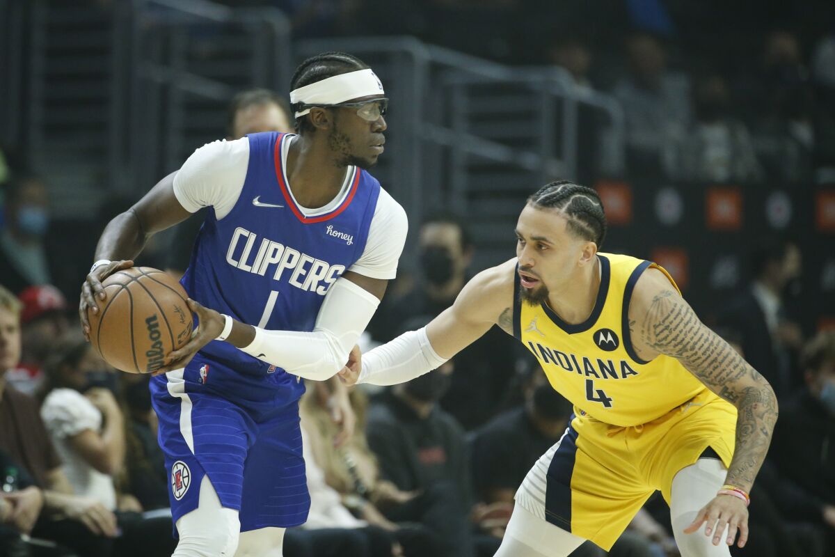 Clippers guard Reggie Jackson, defended by Pacers guard Duane Washington Jr.