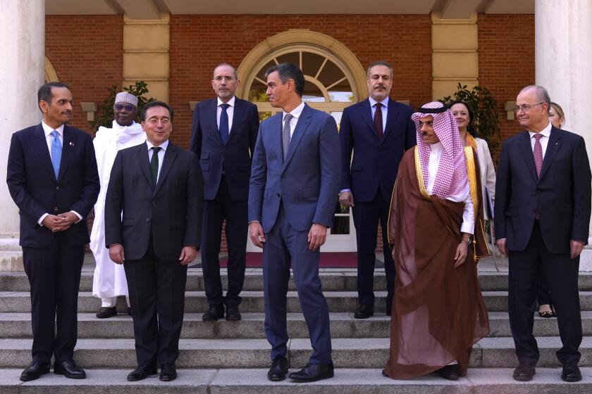 Spain's Prime Minister Pedro Sanchez, center, poses with Spain's Foreign Minister Jose Manuel Albares front row 2nd left and Middle Eastern foreign ministers at the Moncloa Palace in Madrid, Spain, Wednesday, May 29, 2024. Spain is hosting a meeting of the Foreign Ministerial Committee of Arabic and Islamic countries for Gaza a day after Spain, Norway and Ireland formally recognized a Palestinian state. (AP Photo/Manu Fernandez)
