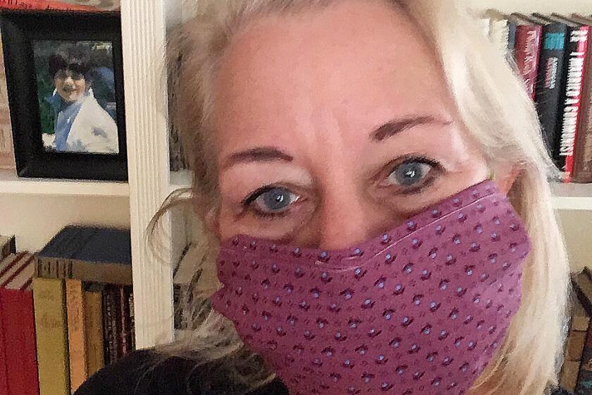 What writer Laura Lippman is reading and watching in quarantine. From Lippman: Here I am, in front of our living room bookshelves, wearing the no-sew mask I learned to make thanks to the tweets of Diedrich Bader. The material comes from a quilt that I literally started THIRTY-SEVEN YEARS ago while living in Waco, Texas. The material and the squares (in the pinwheel pattern) have moved with me in an antique picnic hamper I use as a sewing basket from Waco to San Antonio to Baltimore. I now loathe burgundy in general and this pattern in particular.