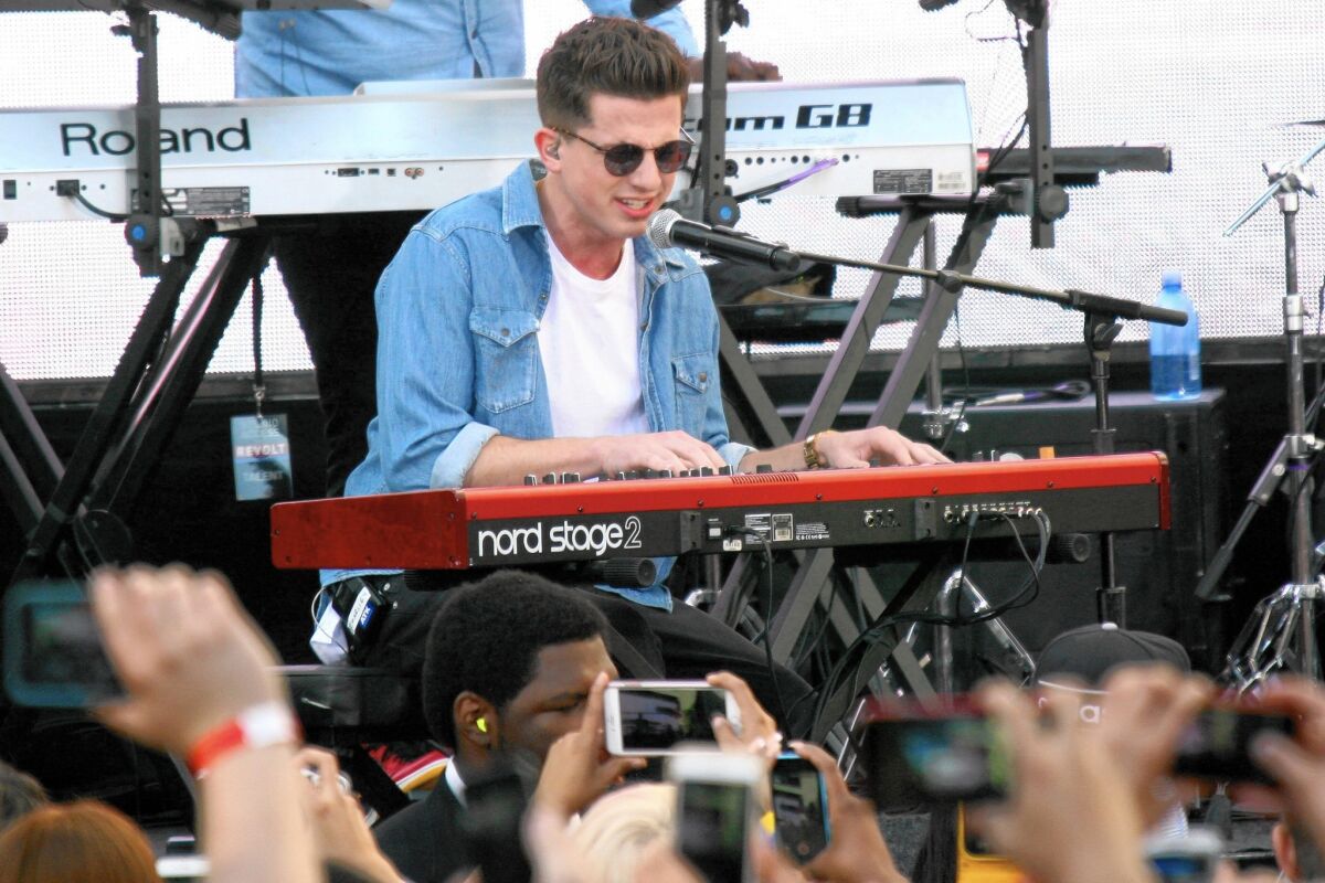Charlie Puth, seen performing April 1 in Hollywood during a "Furious 7" soundtrack event at Revolt Live Studios, wrote and sings "See You Again," the film's Paul Walker tribute song.