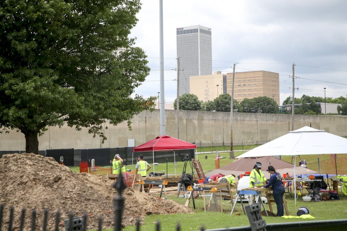 Work continues on excavating remains of possible Tulsa Race Massacre victims at Oaklawn Cemetery on Tuesday, June 8, 2021, in Tulsa, Okla. (Ian Maule/Tulsa World via AP)