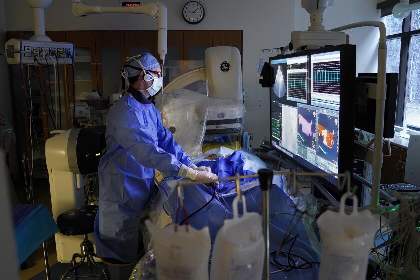 San Diego, CA - February 22: Nicholas Olson, MD Electrophysiology, Cardiovascular Disease with Scripps Clinic in the operating room doing a pulse field ablation procedure at Scripps Memorial Hospital on Thursday, Feb. 22, 2024 in San Diego, CA. (Nelvin C. Cepeda / The San Diego Union-Tribune)