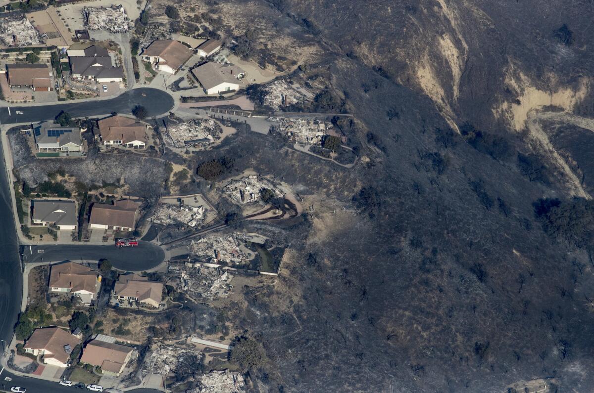 Aerial image shows charred hillside and several homes destroyed by the Thomas fire in Ventura County.