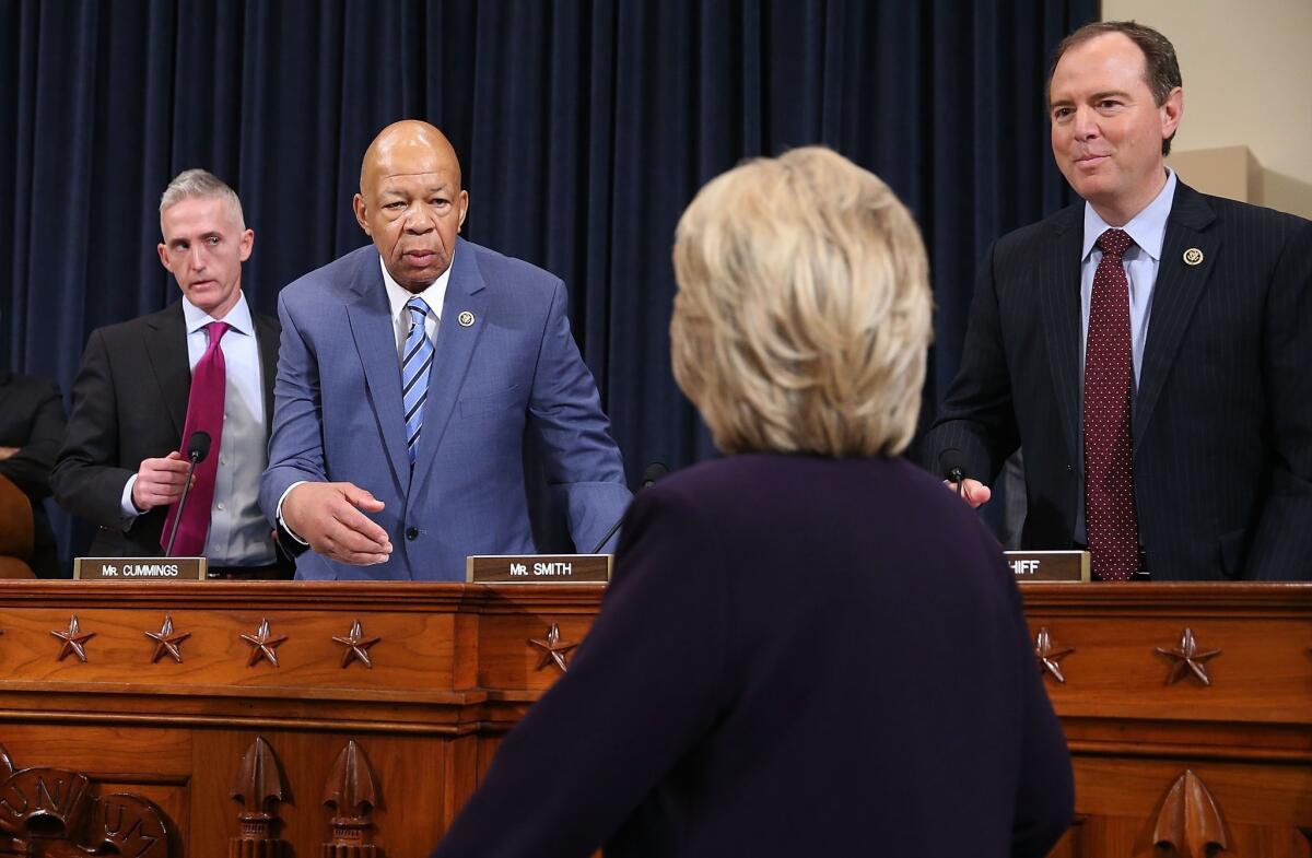 WASHINGTON, DC - OCTOBER 22: Democratic presidential candidate and former Secretary of State Hillary Clinton is greeted by ranking member Rep. Elijah Cummings (D-MD) (2nd L) as chairman Rep. Trey Gowdy (R-SC) (L), and Rep. Adam Schiff (D-CA) (R) look on as she arrives prior to testifying before the House Select Committee on Benghazi October 22, 2015 on Capitol Hill in Washington, DC. The committee held a hearing to continue its investigation on the attack that killed Ambassador Chris Stevens and three other Americans at the diplomatic compound in Benghazi, Libya, on the evening of September 11, 2012. (Photo by Chip Somodevilla/Getty Images) ** OUTS - ELSENT, FPG, CM - OUTS * NM, PH, VA if sourced by CT, LA or MoD **