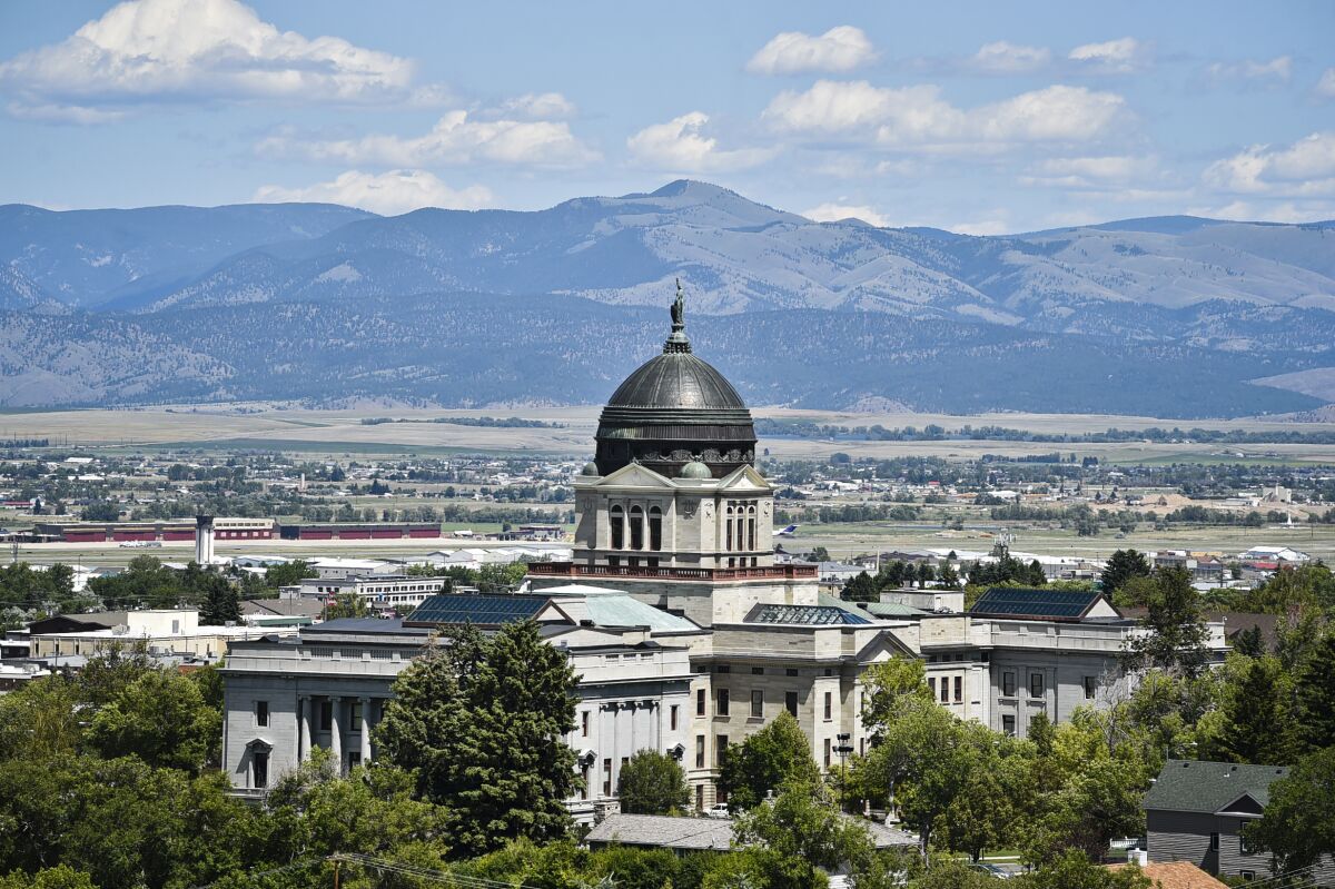 FILE - This July 2020 file photo shows the Montana State Capitol in Helena, Mont. Amid the coronavirus pandemic, Montana's legislature passed restrictive laws severely curbing quarantine and isolation powers, increasing local officials' power over local health boards, preventing limits on religious gatherings, and banning employers — including in health care settings — from requiring vaccinations for COVID, the flu or anything else. (Thom Bridge/Independent Record via AP, File)
