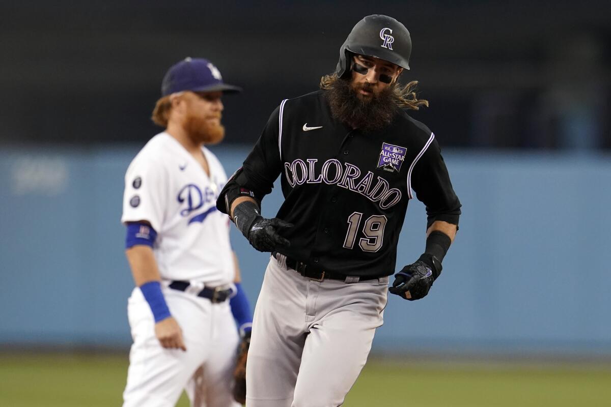 Colorado's Charlie Blackmon rounds third base after hitting a two-run home run during the first inning Friday.
