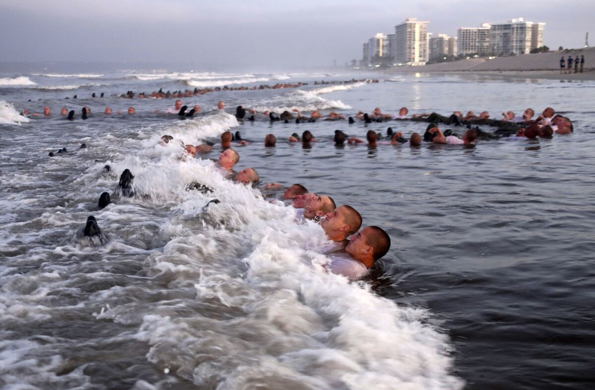 Navy SEAL candidates participate in "surf immersion"  at the Naval Special Warfare Center in Coronado, Calif., on May 4, 2020