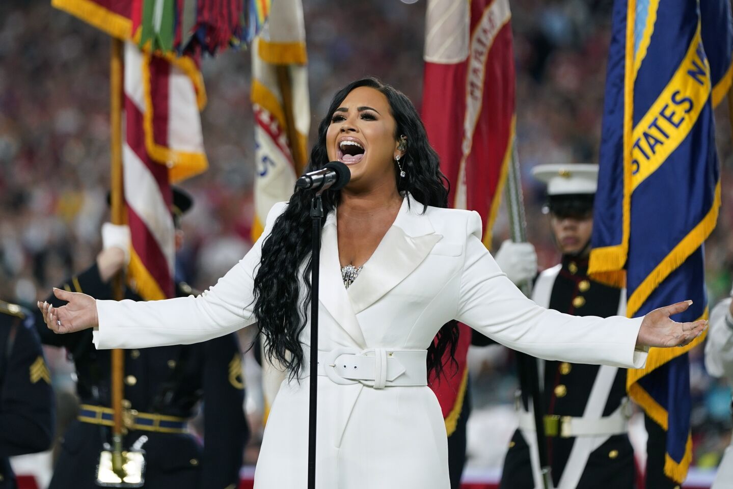 Demi Lovato performs the national anthem before Super Bowl LIV.