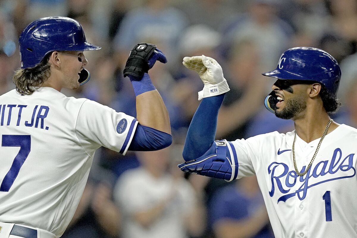 Kansas City Royals' MJ Melendez (1) celebrates with Bobby Witt Jr. (7) after hitting a solo home run during the seventh inning of a baseball game against the Chicago White Sox Wednesday, Aug. 10, 2022, in Kansas City, Mo. (AP Photo/Charlie Riedel)
