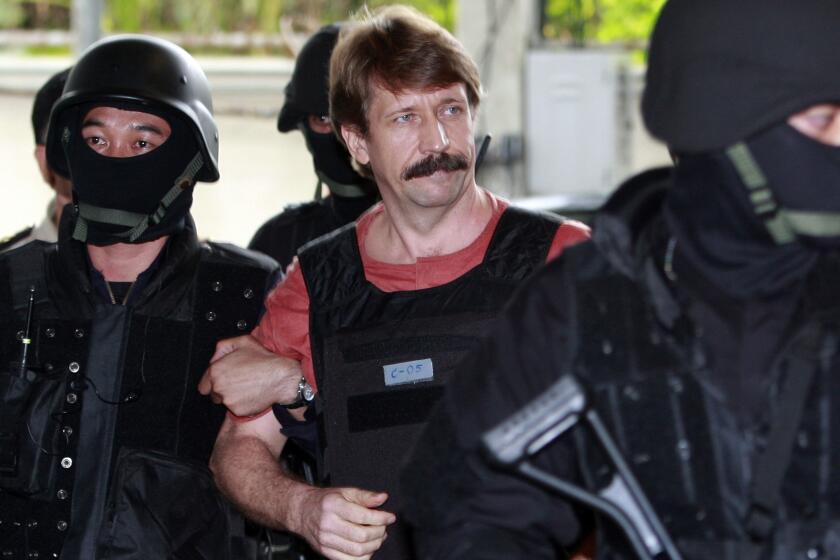Viktor Bout, a Russian arms dealer once labeled the “Merchant of Death,” is escorted to a courtroom in Bangkok in 2010.