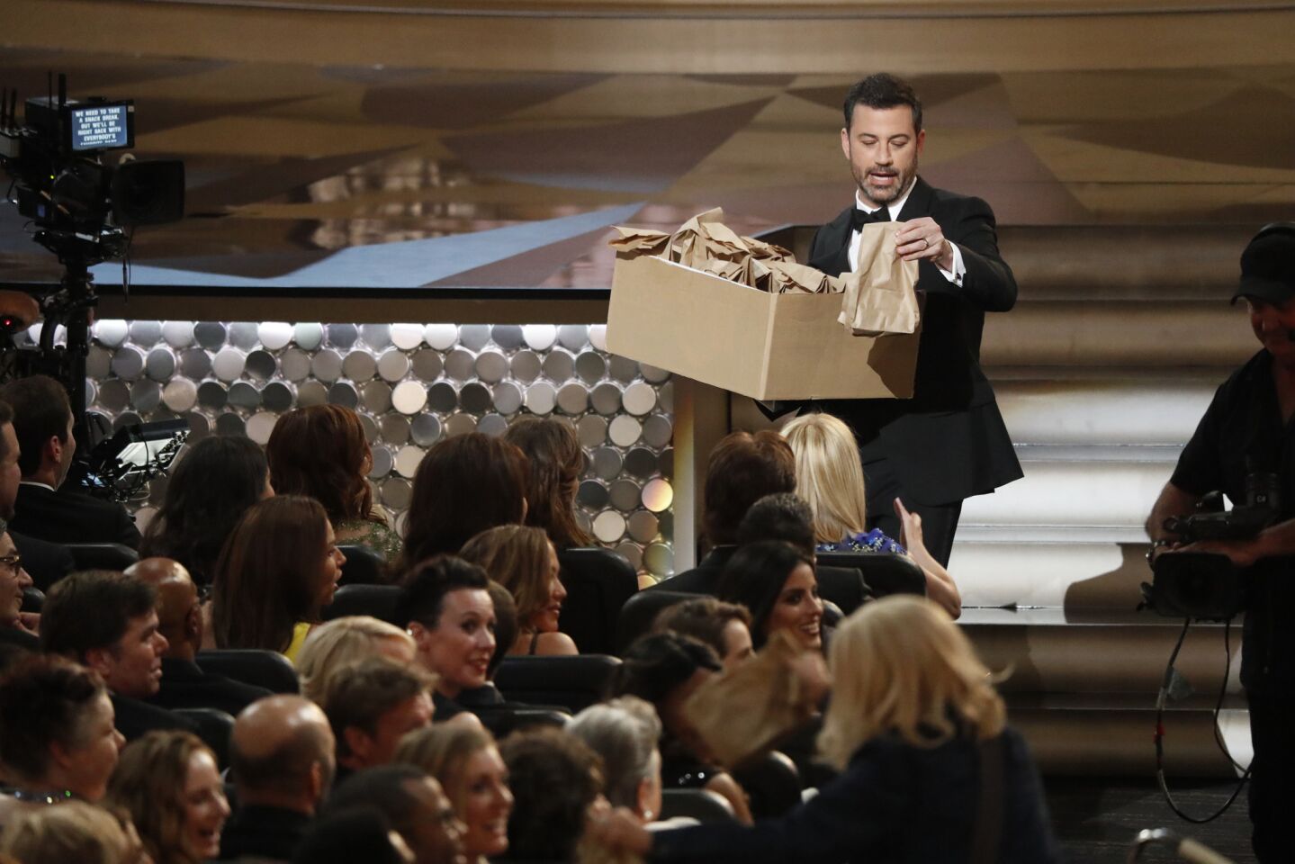 Jimmy Kimmel hands out peanut butter and jelly sandwiches made by his mother during the show.