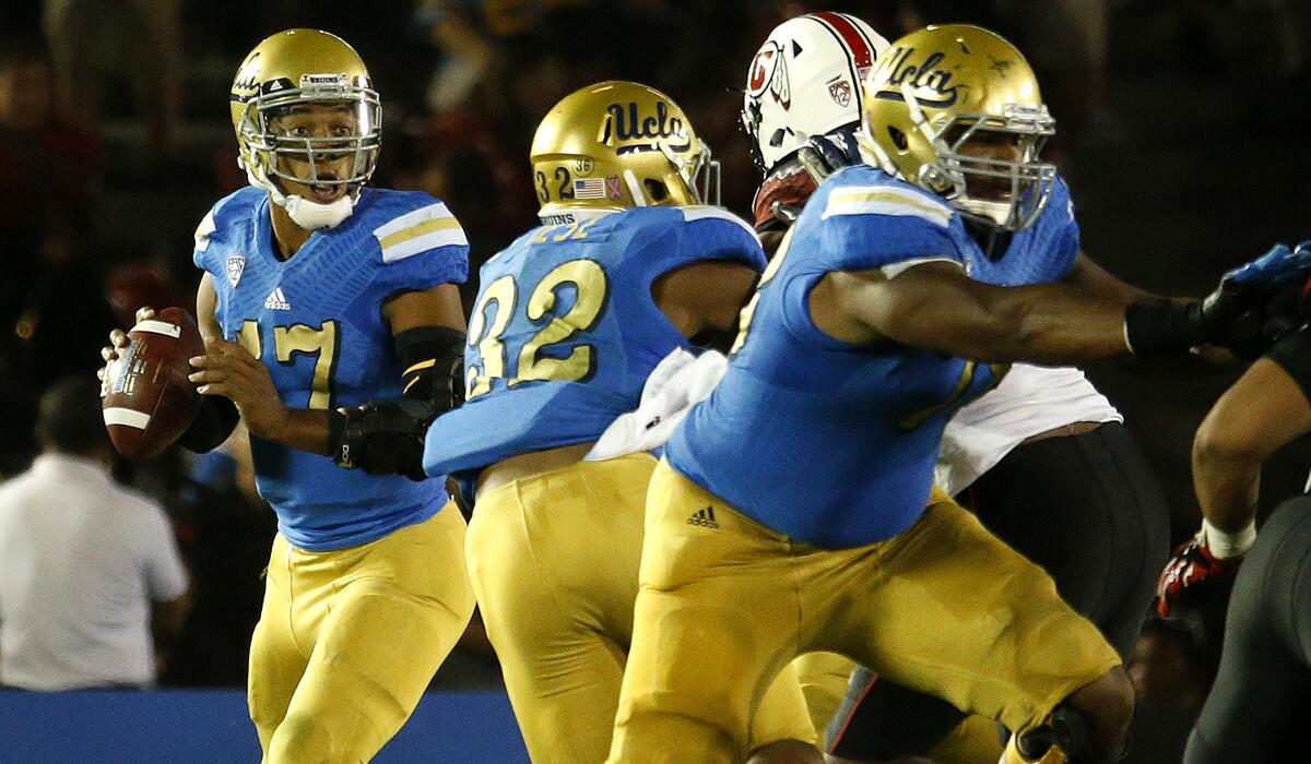 UCLA quarterback Brett Hundley can't find an open receiver as the Utah defense gets past Bruins fullback Nate Iese (32) during the third quarter Saturday at the Rose Bowl.