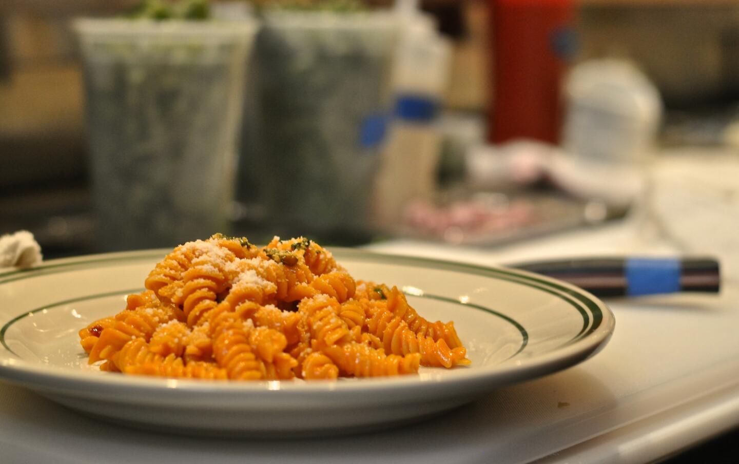 A plate of spicy fusilli with vodka, basil and Parmesan.