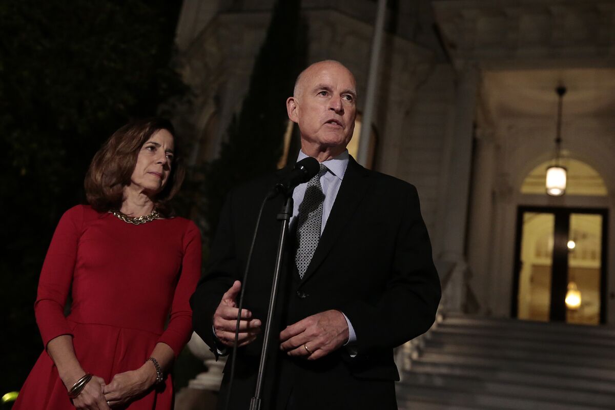 Gov. Jerry Brown and wife, Anne Gust Brown, on the steps of the governor's mansion in Sacramento after he won reelection Nov. 4.