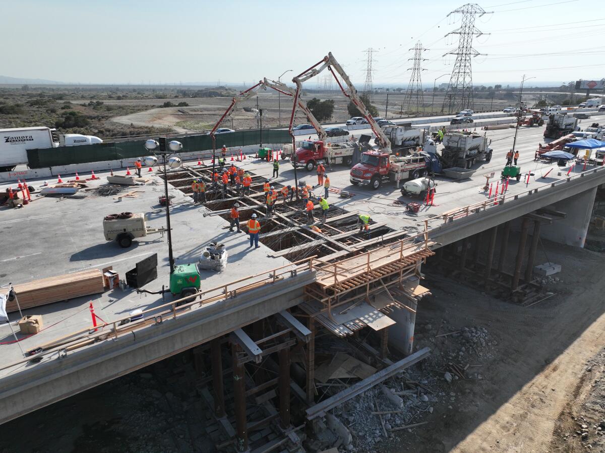 Work crews with the California Department of Transportation working on a renovation project on the 210 Freeway.