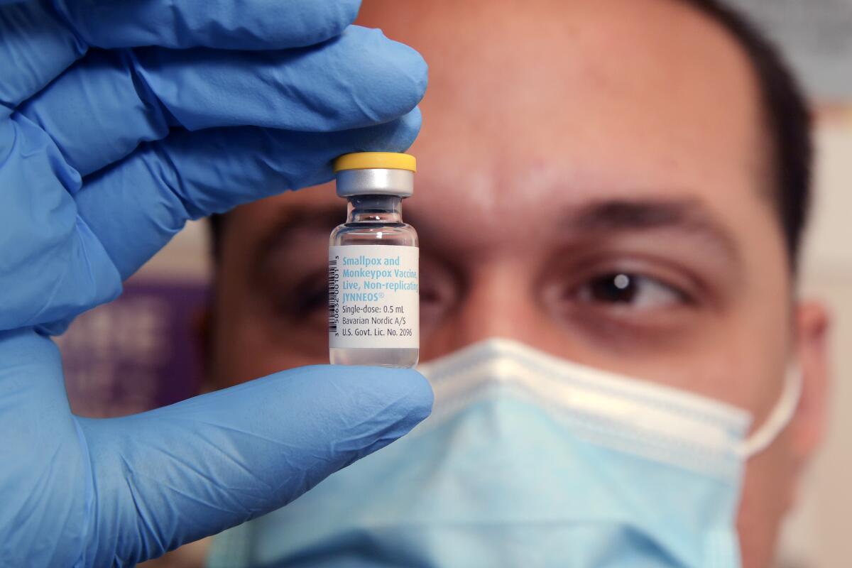 A nurse holds a vial of monkeypox vaccine.