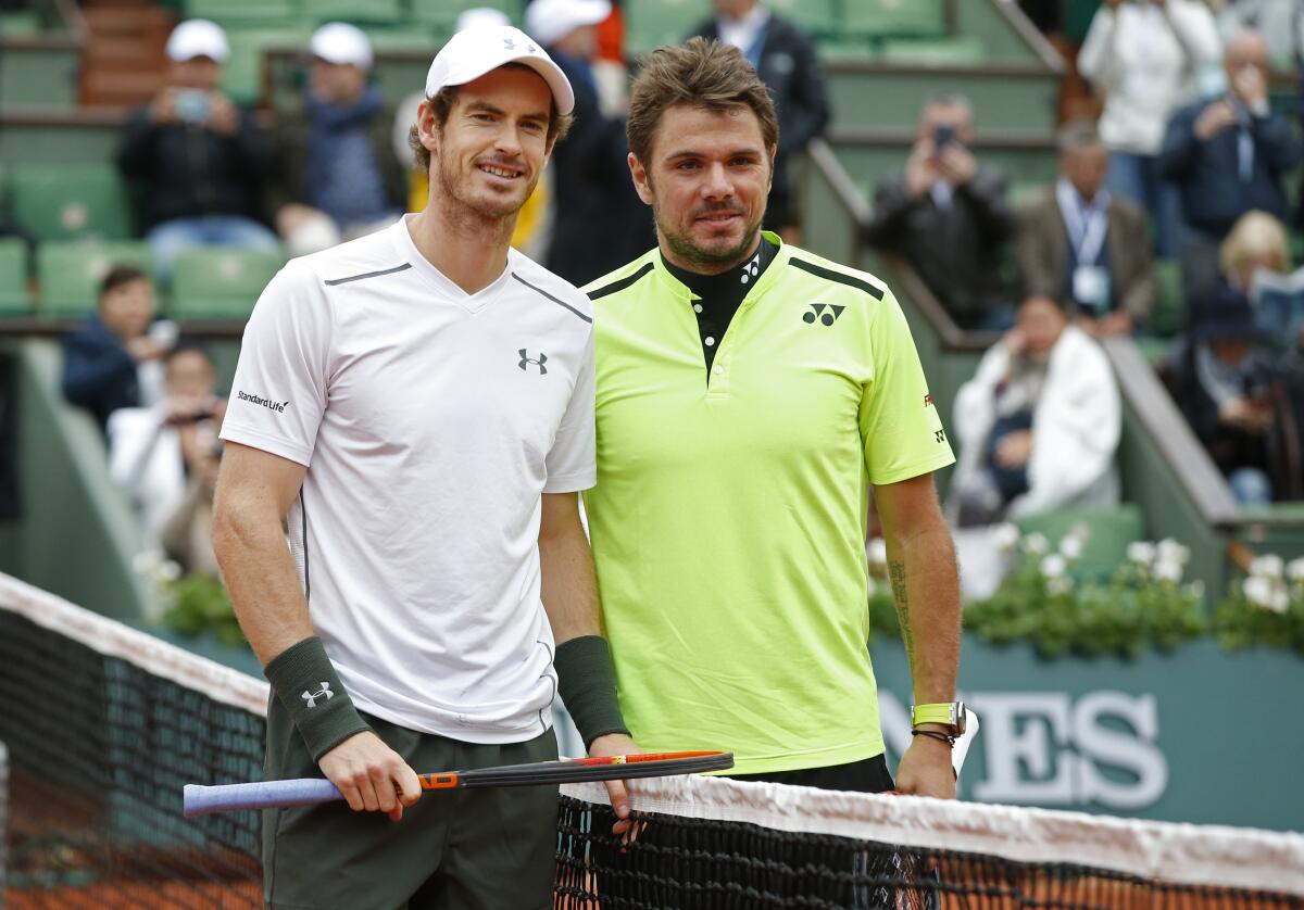 FILE - Britain's Andy Murray, left, and Switzerland's Stan Wawrinka pose for photographers prior to their semifinal match of the French Open tennis tournament at Roland Garros stadium in Paris, France, Friday, June 3, 2016. Stan Wawrinka beat Andy Murray 6-3, 6-0 in Bordeaux, France, on Wednesday, May 17, 2023, in what is believed to be the first ATP Challenger Tour matchup in more than 40 years between two past major champions. (AP Photo/Alastair Grant, File)