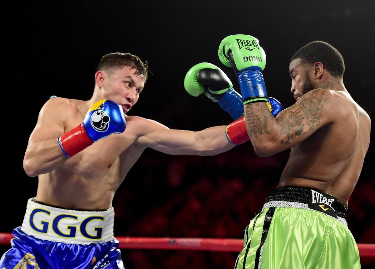 Gennady Golovkin of Kazakhstan punches Dominic Wade on his way to a second-round victory by TKO during a unified middleweight title fight at The Forum on April 23.