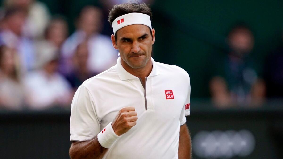 Roger Federer reacts after winning a point against Rafael Nadal in a semifinal at Wimbledon on Friday.