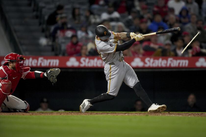 Pirates' Tommy Pham's bat breaks as he singles during the ninth inning of a baseball game against the Angels.