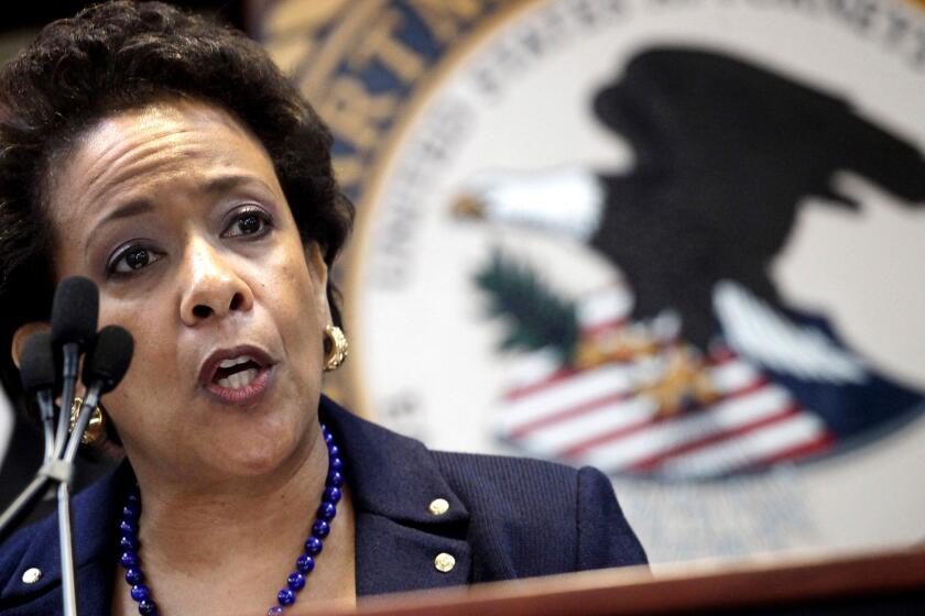 U.S. Attorney General Loretta Lynch announces an indictment against nine FIFA officials and five corporate executives for racketeering, conspiracy and corruption at a news conference Wednesday in New York.