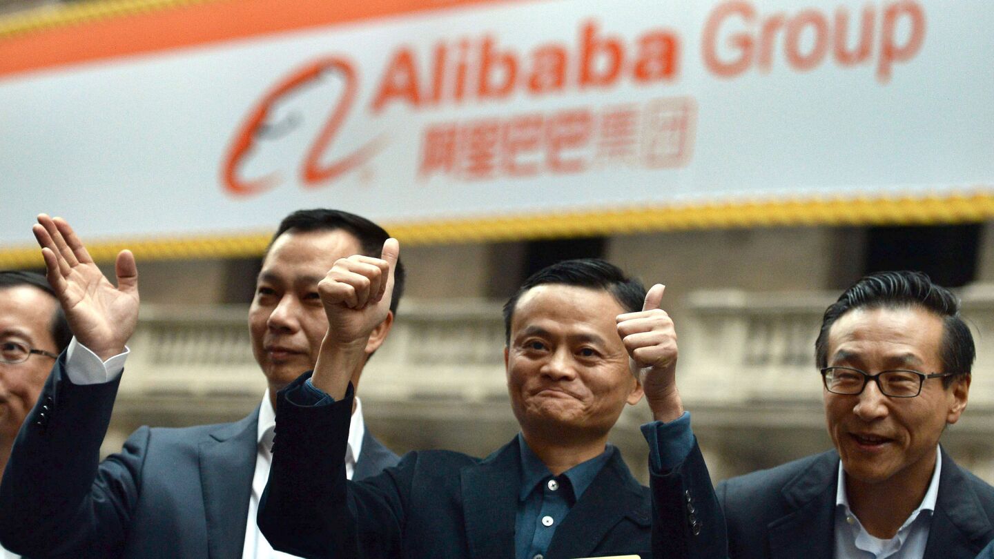 Chinese online retail giant Alibaba CEO Jack Ma, center, arrives at the New York Stock Exchange. Alibaba was poised for a record-breaking stock market debut Friday, with shares priced at $68 in a public offering that could be valued at $25 billion.
